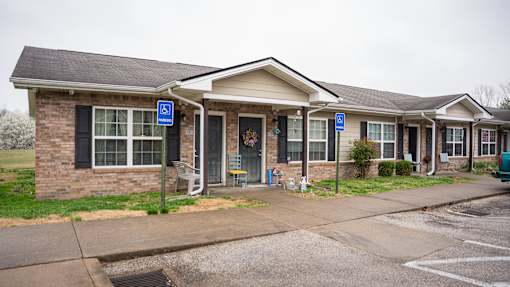 A building with a blue sign on the front.