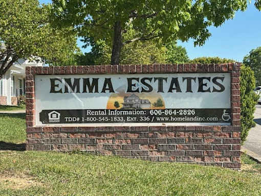 A sign for Emma Estates with rental information.