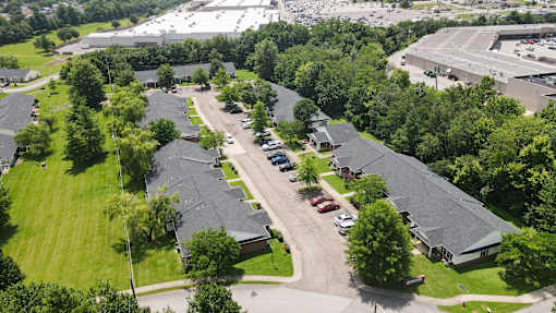 A large industrial area with a parking lot in the foreground.