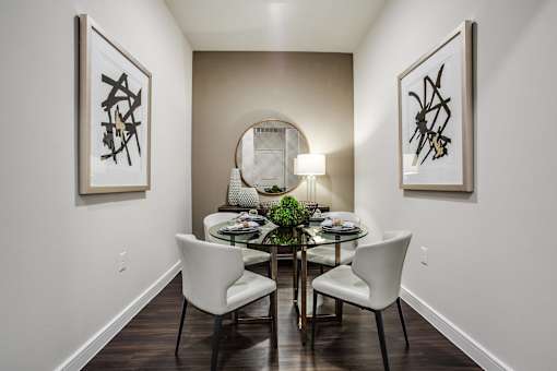 Open-concept dining room with modern furnishings, designer lighting, and convenient access to the gourmet kitchen.