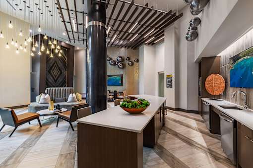 Luxury apartment resident lounge with stylish furnishings, natural light, and space for social gatherings.