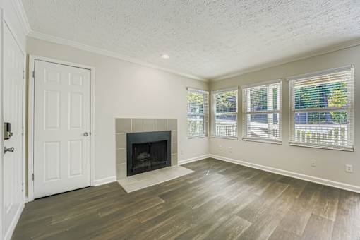 A room with a fireplace and a door.