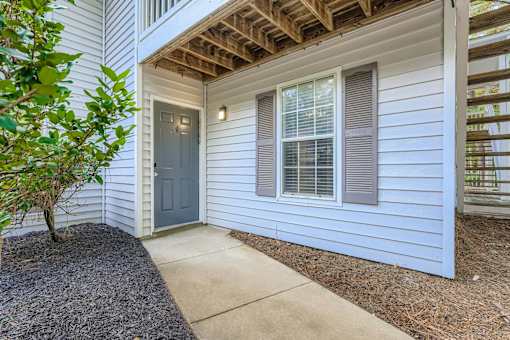 A house with a grey door and window.