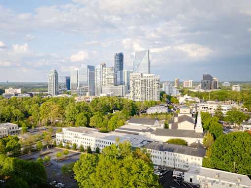 A cityscape with a mix of modern and traditional buildings.