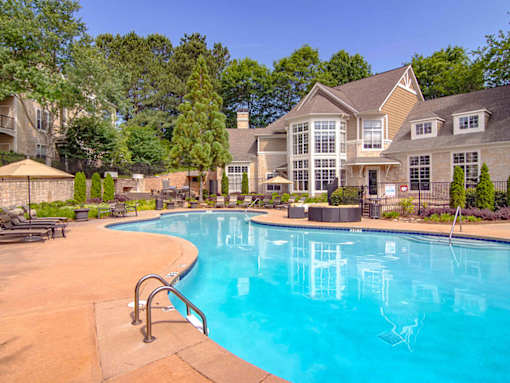 A large house with a pool in the backyard.