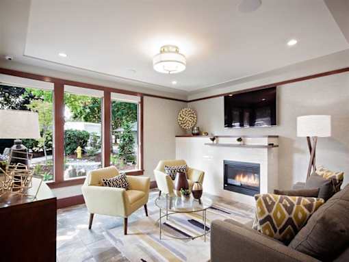 A living room with a fireplace and a couch.