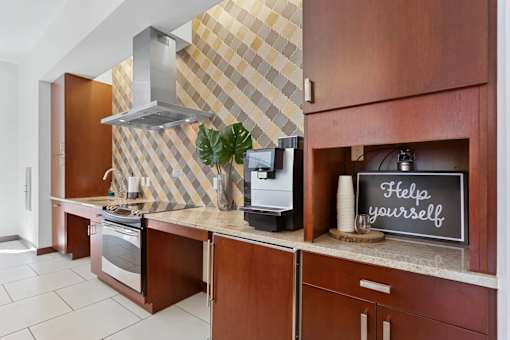 A kitchen with a sign that says "Help yourself" on the counter.