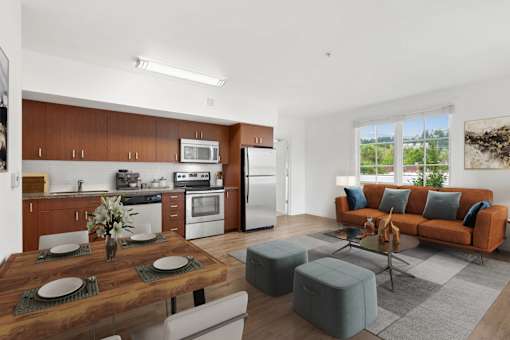 A modern kitchen with a dining table set for two.
