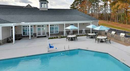A large house with a pool in the backyard.