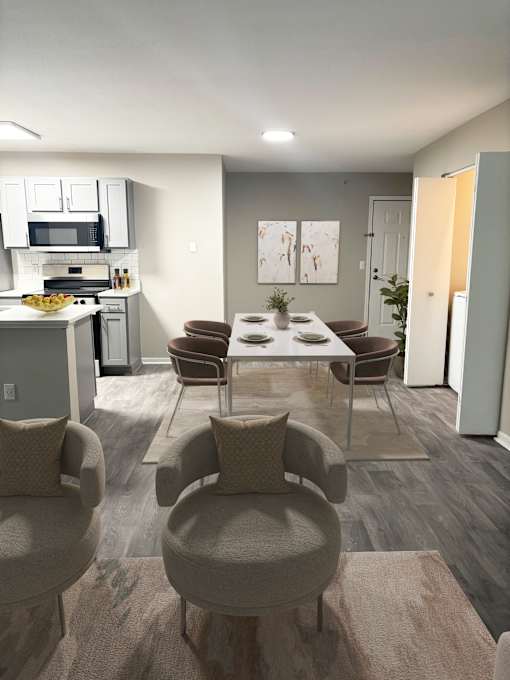A modern kitchen with a dining table and chairs.