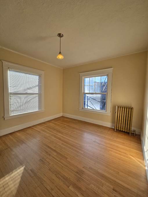 A small attic room with a skylight and a window. at Casa Del Rey Apartments, Portland, Oregon