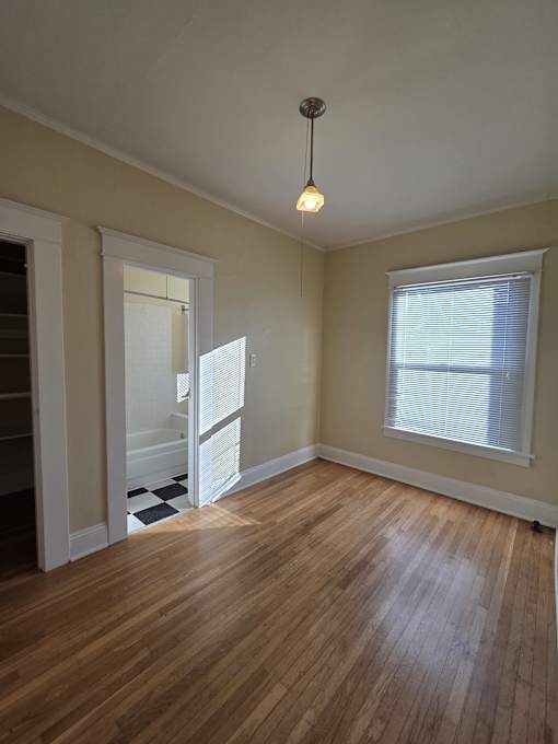 A small attic room with a skylight and a small table. at Casa Del Rey Apartments, Oregon