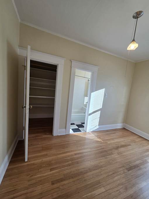 A small attic room with a skylight and a window. at Casa Del Rey Apartments, Portland, 97209