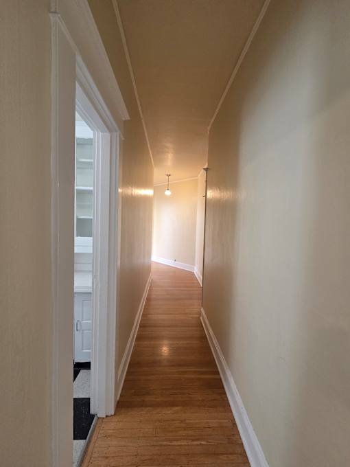 A long, narrow room with wooden walls and a skylight in the middle. at Casa Del Rey Apartments, Portland, OR, 97209