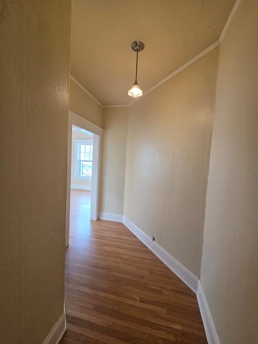 A small attic room with a skylight and a light on. at Casa Del Rey Apartments, Oregon, 97209