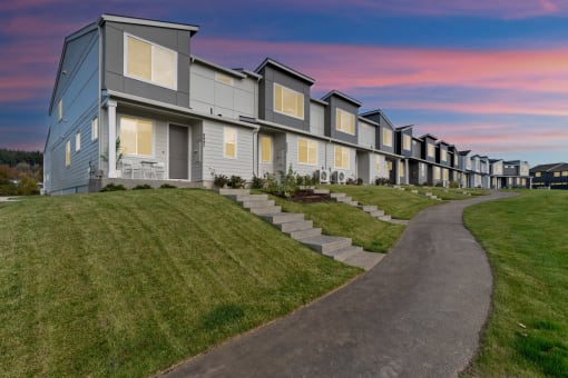 Apartments with a sidewalk in front of it at Thrive at Green Mountain, Washington  , 98607