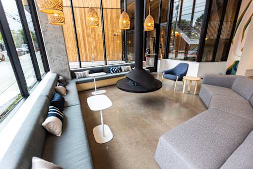 a living room with couches and chairs and a fireplace at Brookland Apartments, Oregon