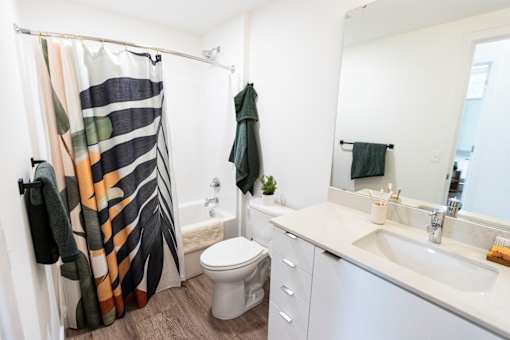 a bathroom with a shower and a sink and a toilet at Brookland Apartments, Oregon 97202