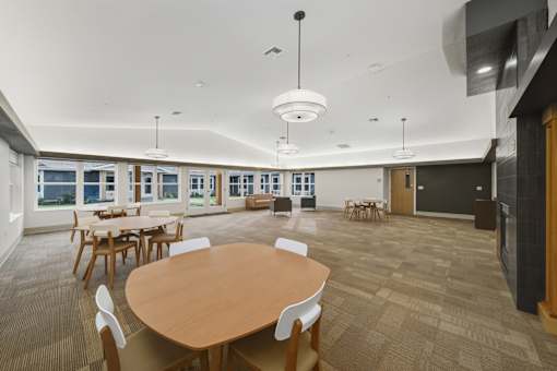 A conference room with a large table and chairs.