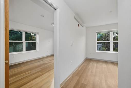 A room with a window and a door.