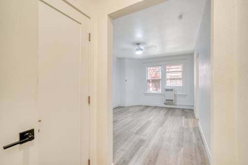 A white door with a black handle is on the left side of the image at Clay & Tiffany, Portland, 97201
