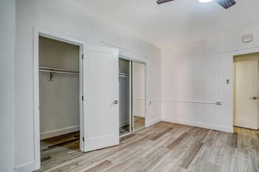 A room with a white door and a wooden floor at Clay & Tiffany, Portland, 97201