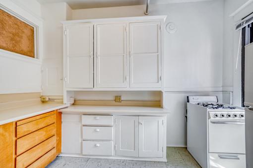 A white kitchen with a stove and oven at Clay & Tiffany, Portland, 97201