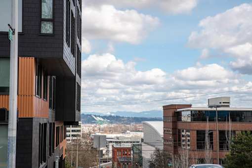 a view of the city and mountains from a building at Analog Tacoma, Tacoma, 98402