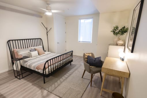 a bedroom with a bed and a desk and a window at Moraine, Tacoma, WA 98402