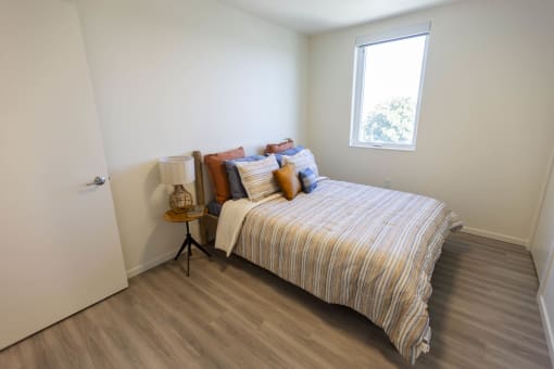a bedroom with a bed and a window at Moraine, Tacoma