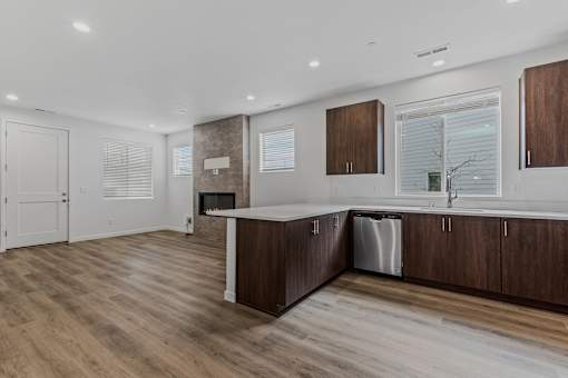 Modern kitchen with wooden floors and cabinets at Thrive at Green Mountain, Washington  , 98607