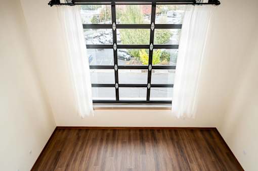 A window overlooking a parking lot at Atomic Orchard Experiment, Portland, 97232