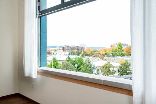 Window with a view of a cityscape at Atomic Orchard Experiment, Portland, OR