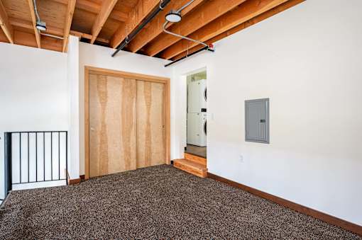 Room with a wooden door at Atomic Orchard Experiment, Portland, OR