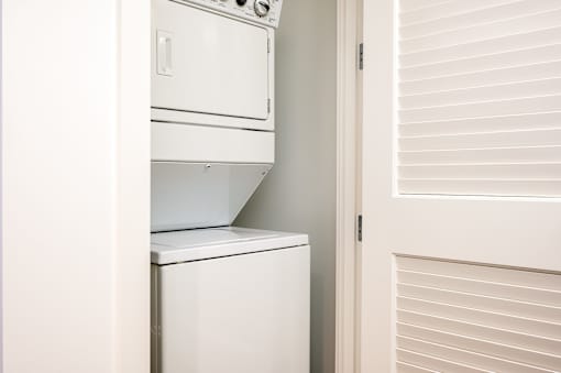 A white dishwasher is installed in a kitchen.