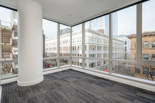 A large room with a view of the city.