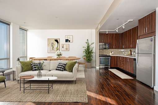 A modern living room with a white couch and a coffee table.