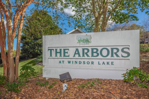 a sign for the arbors at windsor lake