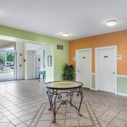 a room with a table and two doors