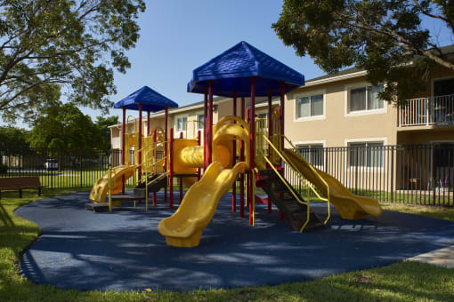 a childrens playground in front of an apartment building