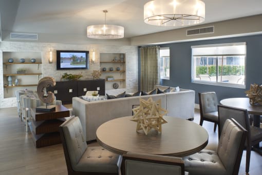 a dining room and living room with a table and chairs
