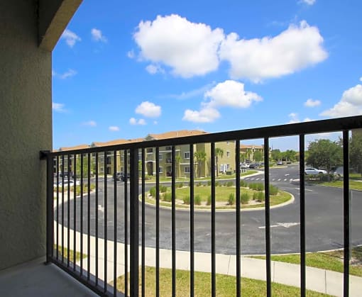a balcony with a view of a parking lot