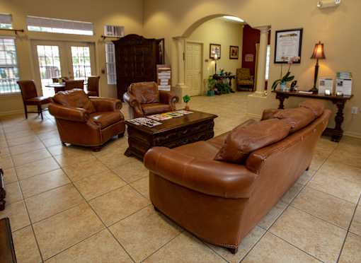 a community clubhouse with couches and chairs