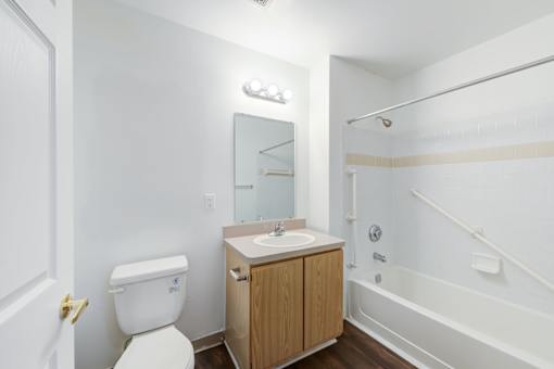 a bathroom with a toilet sink and shower at Carolina Springs Apartments, Carrboro 