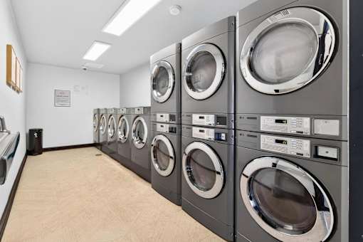 A row of washing machines in a laundromat.