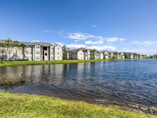 the preserve at ballantyne commons community view of lake with apartment buildings in the background