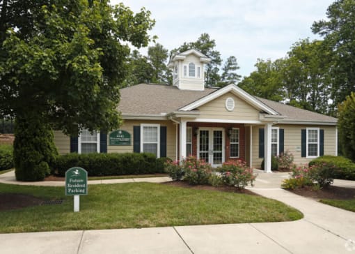 a house with a green sign in front of it