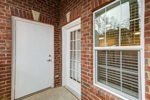 A white door is open to a hallway.
