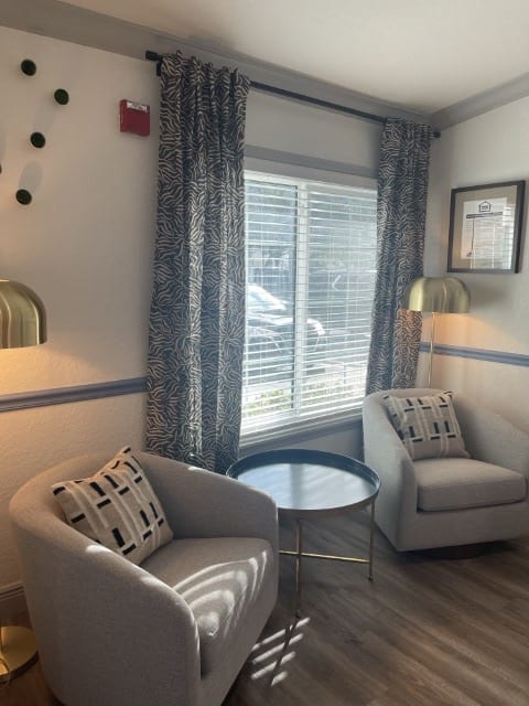 a living room with a couch and a window