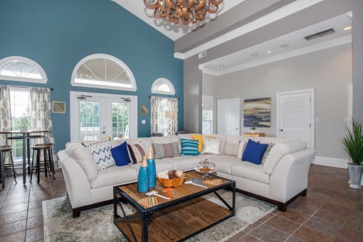 a living room with a couch and a coffee table at Carrington Place at Wildewood, South Carolina, 29223